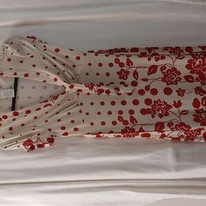 Vintage 40's style deep V with tie at neck and back waist. Cap sleeve, size M